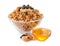 Granola with dried fruits and nuts in bowl and sweet honey on white background