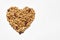 Granola heart shaped on a white background