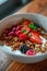 Granola muesli breakfast cereal, with milk and fresh fruit