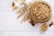 Granola superfood with almond and cashew nuts, dry fruits, raisins cherry in wooden bowl on the white wooden table, top view, brig