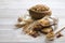 Granola superfood with almond and cashew nuts, dry fruits, raisins cherry in wooden bowl on the white wooden table, top view, brig