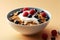 granola and yogurt with cereal, berries mixed with berries in bowl