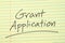 Grant Application On A Yellow Legal Pad