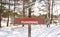 Grant funding symbol. Concept words Grant funding on beautiful wooden road sign. Beautiful forest snow blue sky background.