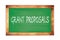 GRANT  PROPOSALS text written on green school board