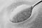 Granulated sugar on a spoon