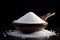 granulated sugar on the table on a black background