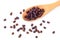 Granules of bee bread in a wooden spoon are isolated on a white background. Apitherapy. Beekeeping products