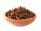 Granules of bee propolis in a clay bowl on a white background. Propolis is a natural antibiotic against viruses and