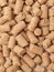 granules of Wheat Bran background. Food for horses and farm animal