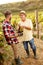 Grape harvest- satisfied father and son working at vineyard