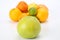 Grapefruit on the background of different citrus fruits on white background