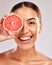 Grapefruit, portrait and black woman in studio for skincare, detox and healthy glow with smile for vegan product