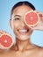 Grapefruit, portrait and woman cover eyes for beauty on studio background, wellness benefits and smile. Happy model