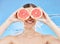 Grapefruit, portrait and woman in studio face, water splash and wellness promotion for skincare, detox and shower