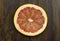 Grapefruit red juicy fresh tropical sliced exotic vitamin fruit on a wood