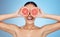 Grapefruit, woman and cover eyes for beauty on studio background, wellness benefits and smile. Skincare model, diet and