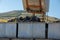 Grapes being dropped to large stainless steel containers.