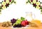 Grapes, dates, garnets, barley, wheat, milk and cheese on the wooden table on a background