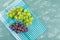 Grapes flat lay on plaster and picnic cloth background