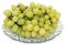 Grapes on a glass plate exposed on white background