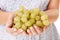 Grapes are great. Cropped image of a womans hands holding a bunch of grapes.