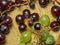 Grapes kishmish on a wooden background. The grapes are overripe. Harvest in the village.