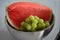 Grapes with watermelon in a metal bowl