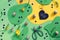 Graphic colorful design Easter background with abstract green and yellow shapes. Flat lay with quail eggs, scissors, heart with