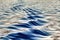 Graphic geometric play of shadows at the waves