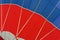 Graphic and geometric texture of hot air balloon, Bottom view, as background for bright moments of life, vivid red and