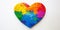 graphic rainbow heart with puzzle on white background for international autism day