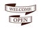 Graphic vintage welcome and open on ribbon