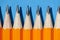 Graphite pencils on a blue background macro photo, school and office supplies