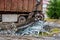 A grapple truck loads scrap industrial metal for recycling.