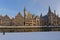 Graslei quay along Lys river, with medieval guild houses on a winter day with snow, Ghent