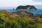 Grass, Cliffs and Lighthouse during sunset at Seaseom, Seogwipo, Jeju Island, South Korea