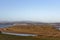 Grass dune with Irish town and cloudy mountains in the background. copy space. Tramore. Waterford. Ireland