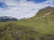 Grass footpath and hill with view on glacier Skaftafellsjokull, Vatnajokull spur in Skaftafell Park, South Iceland