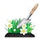 Grass with ground and garden trowel