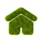 Grass home icon from grass on blue sky background