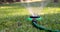 Grass irrigation system - lawn sprinkler spraying water