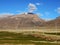 Grass, mountains, blue sky and white clouds in Lhasa`s Countryside