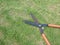 Grass scissors  on grass field background