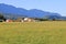 Grassland, Farm Buildings and Rolling Mountains