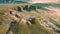 Grasslands wide panorama with autumn grass field and mountains