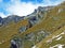 Grassy alpine slopes under the peaks of Falknishorn or Mazorakopf in the Ratikon border mountain massif or Raetikon, Mainfeld