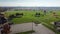 Grassy baseball fields near empty parking lots colorful fall foliage at community recreational center in Rochester, Upstate New