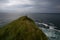 Grassy cliff above the sea.