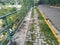 Grassy cobblestone path and empty road